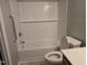 Bathroom featuring a subway tile shower-tub combination and a white countertop sink at 4300 Mantua Way, Raleigh, NC 27604