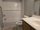 Clean bathroom featuring a white tub, subway tile, and a vanity with countertop space at 4300 Mantua Way, Raleigh, NC 27604