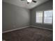 Cozy bedroom with neutral paint, plush carpet, and ample natural light from the double window at 4300 Mantua Way, Raleigh, NC 27604