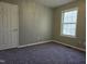 Comfortable bedroom with fresh paint and a window providing natural light and outdoor views at 4300 Mantua Way, Raleigh, NC 27604