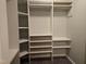 Spacious walk-in closet with built-in shelving and ample room for storage and organization at 4300 Mantua Way, Raleigh, NC 27604
