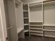 Organized walk-in closet with adjustable shelving and hanging rods for optimal storage solutions at 4300 Mantua Way, Raleigh, NC 27604