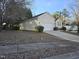 Well-maintained home with a two-car garage, long driveway, and a neatly landscaped front yard at 4300 Mantua Way, Raleigh, NC 27604