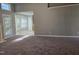 Bright living room with fireplace, gray walls, carpet and breakfast nook with bay windows at 4300 Mantua Way, Raleigh, NC 27604