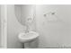 Powder room featuring a pedestal sink, oval mirror, and towel bar at 46 N District Ave # 251, Clayton, NC 27527