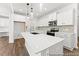 Spacious kitchen with island, white countertops, and stainless steel appliances at 46 N District Ave # 251, Clayton, NC 27527