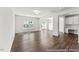 Open-concept living area with hardwood floors, abundant natural light, and a built-in desk at 46 N District Ave # 251, Clayton, NC 27527