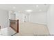 Spacious living room with neutral carpet, recessed lighting, and open layout at 46 N District Ave # 251, Clayton, NC 27527