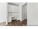 Bright office nook with built in shelving, desk space, and wood floors at 46 N District Ave # 251, Clayton, NC 27527