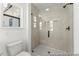 Close-up of the shower with a glass door and neutral colored tile surround at 46 N District Ave # 251, Clayton, NC 27527