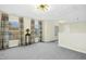 Bright bonus room with natural light, neutral carpet, and elegant window treatments at 509 Loblolly Dr, Durham, NC 27712