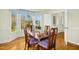 Bright dining room features a bay window, hardwood floors, and classic wooden furniture for elegant dining at 509 Loblolly Dr, Durham, NC 27712