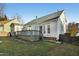 A sprawling back exterior shows a classic two-story home with a spacious back deck and well-maintained backyard at 509 Loblolly Dr, Durham, NC 27712