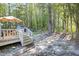 Spacious backyard with a deck, table, and grill at 5108 Walton Hill Rd, Knightdale, NC 27545