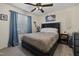 Comfortable bedroom featuring a ceiling fan, window, and stylish decor at 5108 Walton Hill Rd, Knightdale, NC 27545