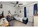 Vibrant bedroom with a fan, window, and colorful decor at 5108 Walton Hill Rd, Knightdale, NC 27545