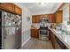 Well-lit kitchen with stainless steel appliances and plenty of counter space at 5108 Walton Hill Rd, Knightdale, NC 27545