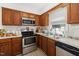 Functional kitchen with stainless steel appliances, lots of counter space, and bright lighting at 5108 Walton Hill Rd, Knightdale, NC 27545