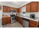 Functional kitchen featuring stainless steel appliances and ample cabinet space at 5108 Walton Hill Rd, Knightdale, NC 27545