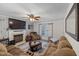 Comfortable living room with a fireplace and a large window at 5108 Walton Hill Rd, Knightdale, NC 27545