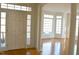 Home foyer features gleaming hardwood floors, white columns, and lots of natural light through the front door at 51207 Eastchurch, Chapel Hill, NC 27517