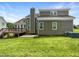 Exterior view of home with expansive backyard, wooden deck and lush green lawn at 5317 Tifton Dr, Raleigh, NC 27610