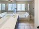 This bathroom features double sinks, a soaking tub, and a walk-in shower at 5317 Tifton Dr, Raleigh, NC 27610