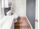 This bathroom has a shower/tub, a single sink, and vinyl wood-look flooring at 5317 Tifton Dr, Raleigh, NC 27610
