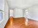 Bright bedroom featuring hardwood floors and ample natural light, enhancing the room's inviting ambiance at 5317 Tifton Dr, Raleigh, NC 27610