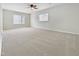Spacious bedroom with plush carpeting, neutral walls, and abundant natural light from large windows at 5317 Tifton Dr, Raleigh, NC 27610