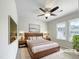 Serene bedroom featuring a large bed, modern decor, and soft natural light at 5317 Tifton Dr, Raleigh, NC 27610
