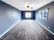This bedroom has gray walls, a ceiling fan, and neutral carpet at 5317 Tifton Dr, Raleigh, NC 27610