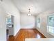 Inviting dining room with gleaming hardwood floors and decorative light fixture at 5317 Tifton Dr, Raleigh, NC 27610