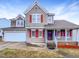 Charming two-story home with a well-manicured front yard and attached garage at 5317 Tifton Dr, Raleigh, NC 27610