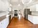 Bright and modern kitchen with stainless steel appliances and hardwood floors at 5317 Tifton Dr, Raleigh, NC 27610