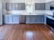 This kitchen features gray cabinets, stainless steel appliances, and a subway tile backsplash at 5317 Tifton Dr, Raleigh, NC 27610