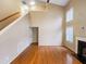 Spacious living room features gleaming hardwood floors, a fireplace, and lots of natural light at 5317 Tifton Dr, Raleigh, NC 27610