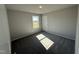 Bedroom featuring neutral walls, carpet flooring, a window for natural light, and a closet door at 57 Faucette Dr, Selma, NC 27576