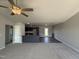 Comfortable living room offering views into the modern kitchen with granite countertops and dark cabinetry at 57 Faucette Dr, Selma, NC 27576