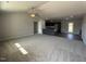 Expansive living area with a seamless flow into the kitchen, highlighting modern design and ample natural light at 57 Faucette Dr, Selma, NC 27576