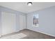 Bedroom featuring carpet flooring, a window, and a closet space at 605 Stratton Way, Durham, NC 27704
