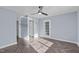 Bedroom featuring herringbone flooring, a modern ceiling fan, and a door to the exterior at 605 Stratton Way, Durham, NC 27704