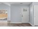 Bright entryway with light blue walls, white trim, and stylish herringbone floors at 605 Stratton Way, Durham, NC 27704