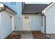 Exterior of the home with two white doors and light blue siding at 605 Stratton Way, Durham, NC 27704