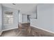 Open living space with herringbone floors, ample natural light, and staircase access at 605 Stratton Way, Durham, NC 27704