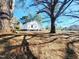 A tree filled backyard at 606 E Pearsall St, Dunn, NC 28334