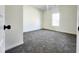 Cozy bedroom with plush carpeting and a bright window at 606 E Pearsall St, Dunn, NC 28334