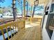 An inviting porch featuring a modern light fixture and fresh wood at 606 E Pearsall St, Dunn, NC 28334