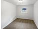 Cozy bedroom with neutral carpet and bright window at 623 Sybil Dr, Durham, NC 27703