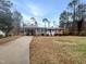 Well maintained front yard with charming brick home and covered carport at 623 Sybil Dr, Durham, NC 27703
